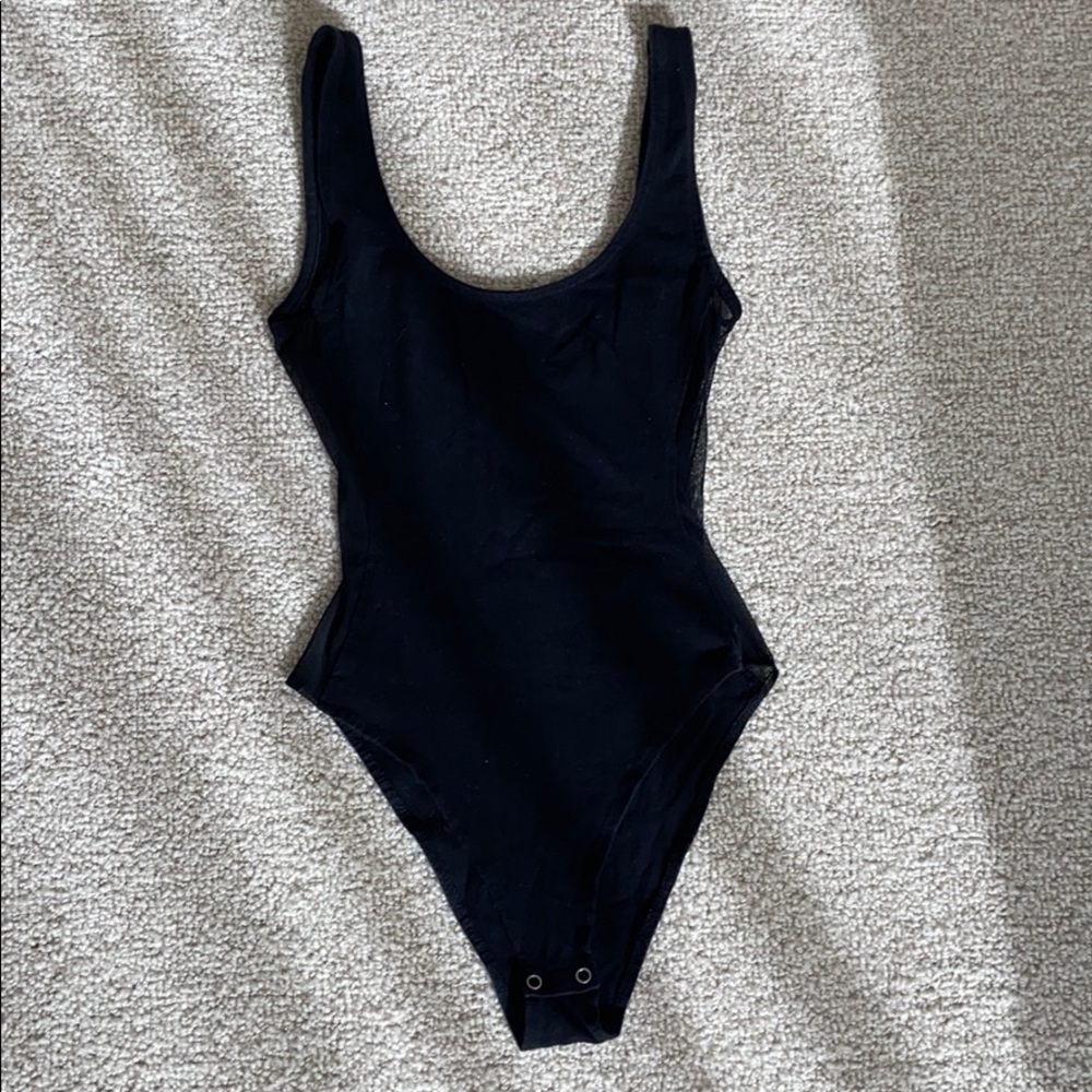 Black bodysuit with mesh detail on side
